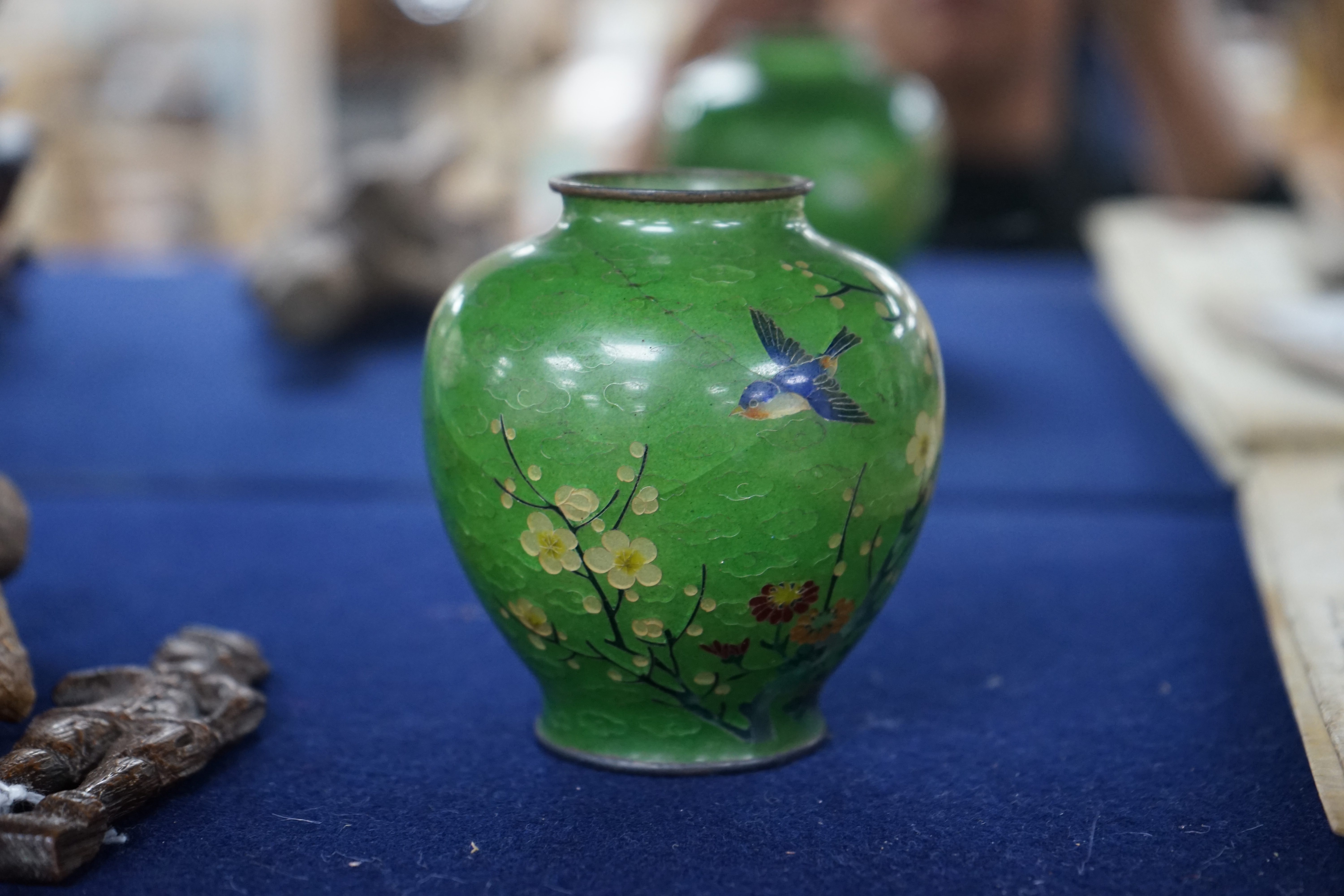 A Japanese silver wire plique a jour enamel green ground vase, early 20th century, 8.5cm. Condition - large cracks to body otherwise in reasonable condition